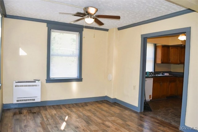 1642 Free State Rd, Meherrin, VA 23954 - unfurnished room with heating unit, crown molding, dark wood-style flooring, ceiling fan, and a textured ceiling