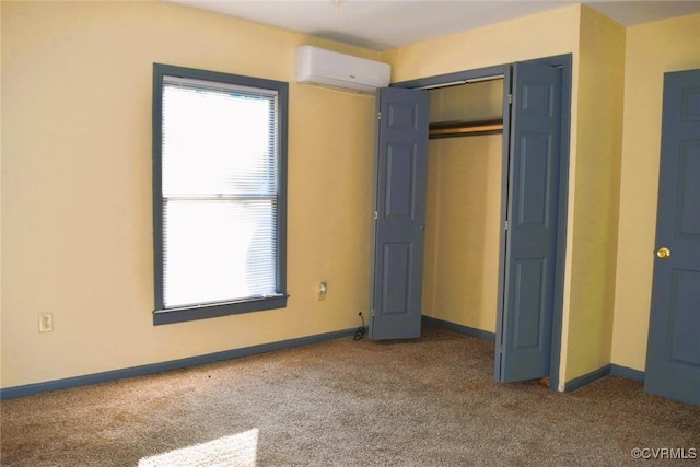 1642 Free State Rd, Meherrin, VA 23954 - unfurnished bedroom with an AC wall unit, carpet, and a closet