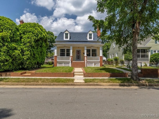 3303 Woodrow Ave, Richmond, VA 23222 - cape cod home with a porch and a chimney