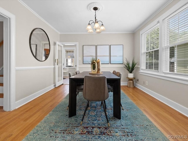 3303 Woodrow Ave, Richmond, VA 23222 - dining room with a chandelier, crown molding, and wood finished floors