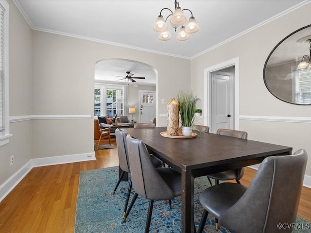 3303 Woodrow Ave, Richmond, VA 23222 - dining space with arched walkways, wood finished floors, crown molding, ceiling fan, and a chandelier