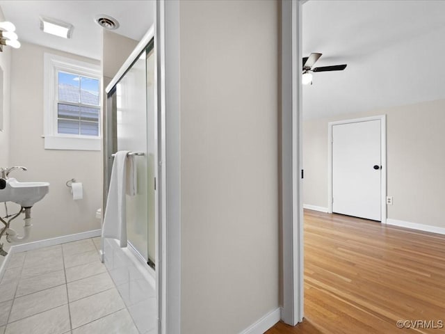 3303 Woodrow Ave, Richmond, VA 23222 - full bath with an enclosed shower, a ceiling fan, and wood finished floors