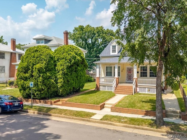 3303 Woodrow Ave, Richmond, VA 23222 - view of front of house with a porch and a front yard