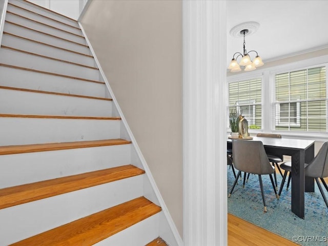 3303 Woodrow Ave, Richmond, VA 23222 - staircase with a chandelier and wood finished floors