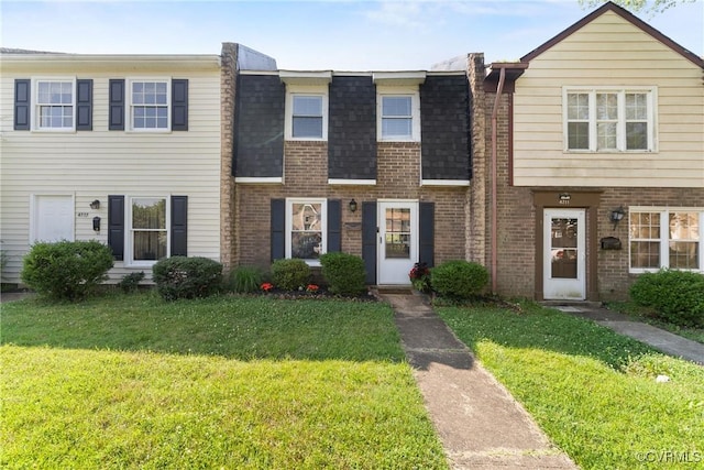 4709 Leadenhall Dr, Chesterfield, VA 23234 - view of property featuring brick siding, a front yard, and a shingled roof