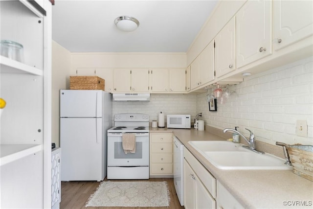 4709 Leadenhall Dr, Chesterfield, VA 23234 - kitchen featuring white appliances, under cabinet range hood, light countertops, light wood-type flooring, and decorative backsplash