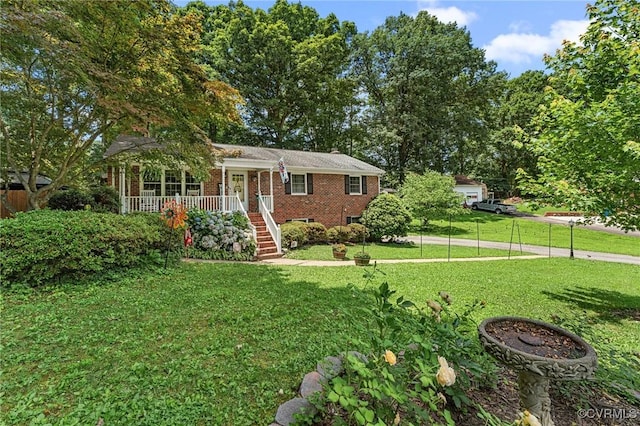 1200 Hybla Rd, Richmond, VA 23236 - view of front of house with covered porch, a front yard, brick siding, and stairs