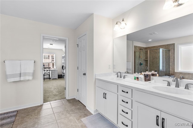 14942 Bridge Spring Dr, Midlothian, VA 23113 - bathroom featuring a stall shower, double vanity, and tile patterned flooring