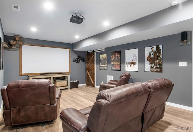 14942 Bridge Spring Dr, Midlothian, VA 23113 - home theater room with a barn door, light wood finished floors, and recessed lighting