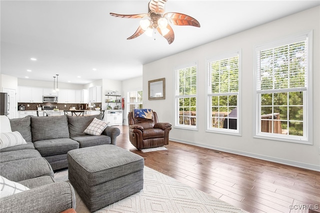 14942 Bridge Spring Dr, Midlothian, VA 23113 - living room featuring plenty of natural light, ceiling fan, wood finished floors, and recessed lighting
