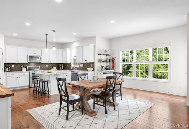 14942 Bridge Spring Dr, Midlothian, VA 23113 - dining space with plenty of natural light, light wood-style floors, and recessed lighting