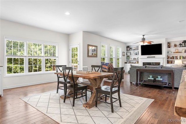 14942 Bridge Spring Dr, Midlothian, VA 23113 - dining room featuring a ceiling fan, a fireplace, wood finished floors, and recessed lighting