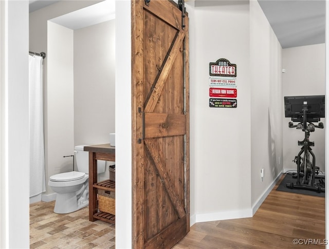 14942 Bridge Spring Dr, Midlothian, VA 23113 - corridor with a barn door and wood finished floors