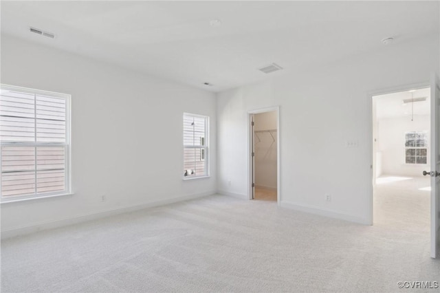 124 Steyland St, Ashland, VA 23005 - unfurnished bedroom featuring light carpet and a spacious closet