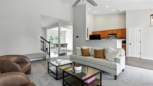 3208 Warm Springs Way, Henrico, VA 23223 - living area featuring a towering ceiling, a ceiling fan, light colored carpet, stairway, and recessed lighting