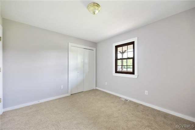 10324 Lamore Dr, Disputanta, VA 23842 - unfurnished bedroom featuring carpet floors and a closet