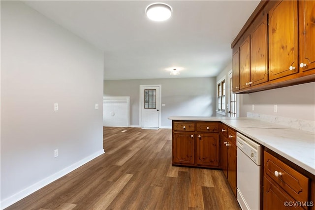 10324 Lamore Dr, Disputanta, VA 23842 - kitchen featuring white dishwasher, a peninsula, brown cabinetry, dark wood-style floors, and light countertops