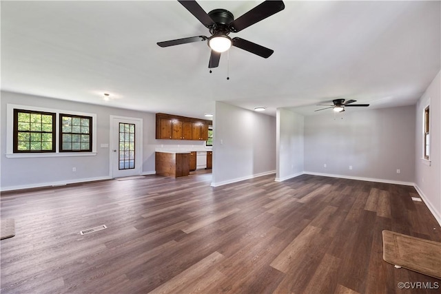 10324 Lamore Dr, Disputanta, VA 23842 - unfurnished living room featuring a ceiling fan and dark wood-type flooring