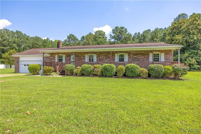 10324 Lamore Dr, Disputanta, VA 23842 - single story home featuring a front lawn, an attached garage, a porch, a chimney, and brick siding