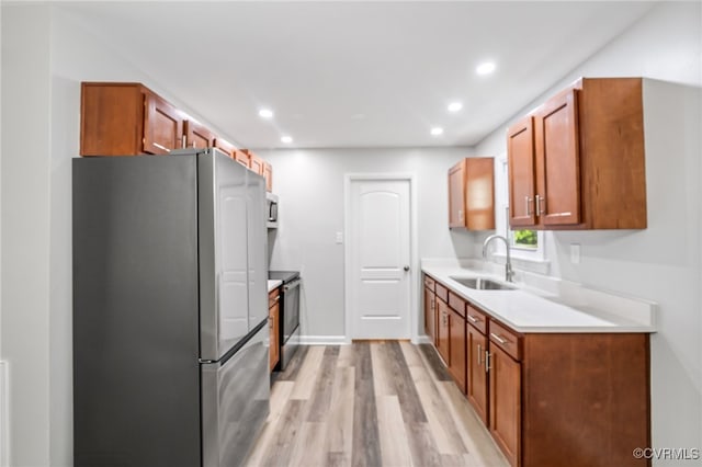 6512 N Stevens Hollow Dr, Chesterfield, VA 23832 - kitchen with appliances with stainless steel finishes, light wood-type flooring, light countertops, recessed lighting, and brown cabinets