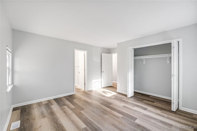 6512 N Stevens Hollow Dr, Chesterfield, VA 23832 - unfurnished bedroom with wood finished floors and a closet