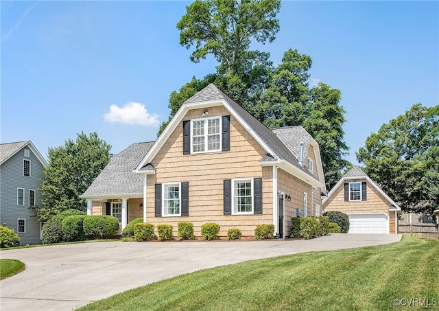1204 Bowden Rd, Henrico, VA 23229 - view of front of home featuring roof with shingles, a front lawn, a detached garage, and an outbuilding