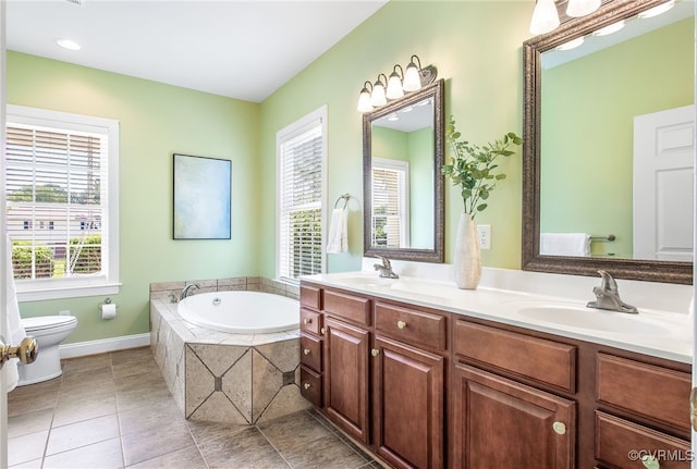 1204 Bowden Rd, Henrico, VA 23229 - full bathroom featuring healthy amount of natural light, a bath, double vanity, and tile patterned floors