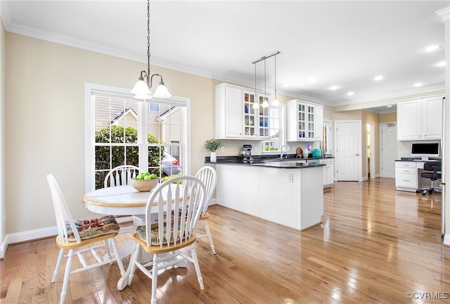 1204 Bowden Rd, Henrico, VA 23229 - dining space with a chandelier, ornamental molding, light wood-style floors, and recessed lighting