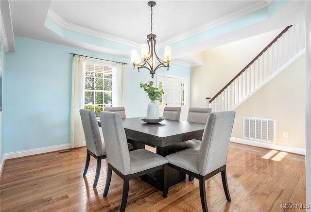 1204 Bowden Rd, Henrico, VA 23229 - dining area featuring a chandelier, ornamental molding, and light wood-style flooring