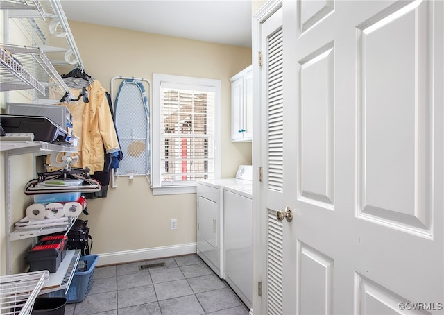 1204 Bowden Rd, Henrico, VA 23229 - laundry room featuring cabinet space, washer and clothes dryer, and light tile patterned flooring