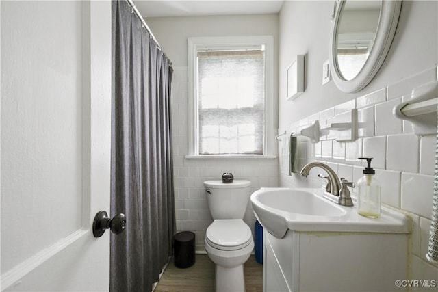 202 Larne Ave, Richmond, VA 23224 - bathroom with vanity, healthy amount of natural light, tile walls, and wood finished floors