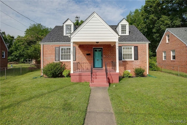 202 Larne Ave, Richmond, VA 23224 - cape cod house with brick siding, a porch, and roof with shingles