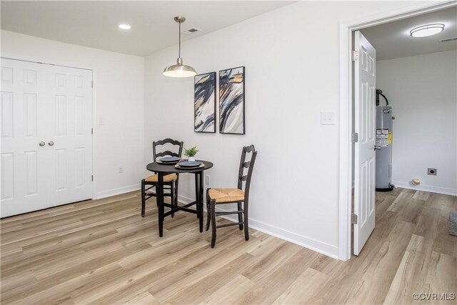 25713 Simmons Ave, North Dinwiddie, VA 23803 - dining area with light wood-type flooring, electric water heater, and recessed lighting