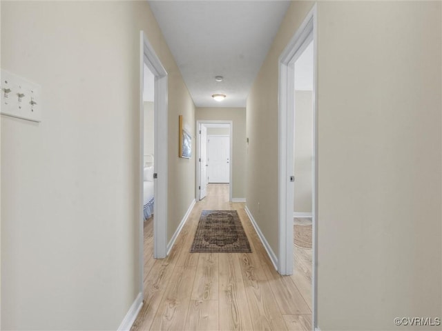 621 Fort Lowry Ln, Dunnsville, VA 22454 - hall with light wood-style floors and baseboards