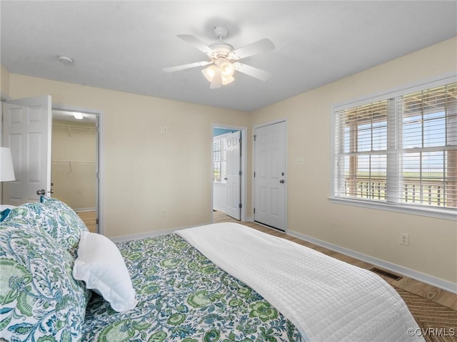 621 Fort Lowry Ln, Dunnsville, VA 22454 - bedroom with ceiling fan and a spacious closet