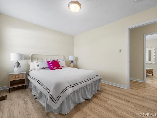 621 Fort Lowry Ln, Dunnsville, VA 22454 - bedroom featuring light wood-style flooring and baseboards