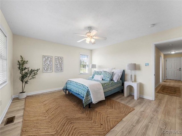 621 Fort Lowry Ln, Dunnsville, VA 22454 - bedroom with light wood finished floors and a ceiling fan
