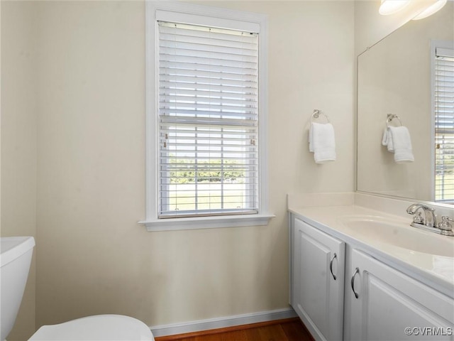 621 Fort Lowry Ln, Dunnsville, VA 22454 - bathroom with vanity and wood finished floors