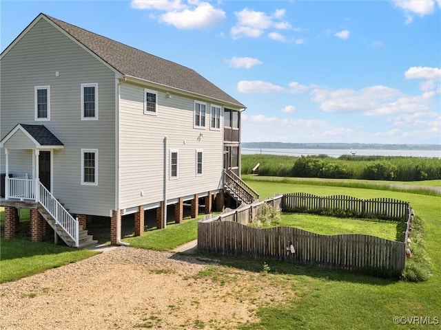 621 Fort Lowry Ln, Dunnsville, VA 22454 - rear view of house featuring stairway, a water view, and driveway