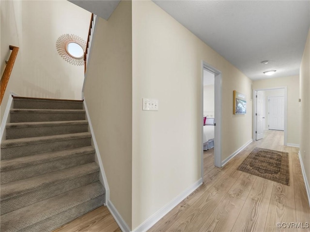 621 Fort Lowry Ln, Dunnsville, VA 22454 - hall featuring light wood-style flooring and stairs