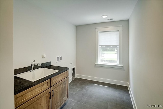 2500 Madison Station Ct, Henrico, VA 23233 - laundry area with hookup for an electric dryer, cabinet space, washer hookup, and dark tile patterned floors
