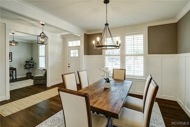 2500 Madison Station Ct, Henrico, VA 23233 - dining area featuring a chandelier, a decorative wall, dark wood-style flooring, a wainscoted wall, and crown molding