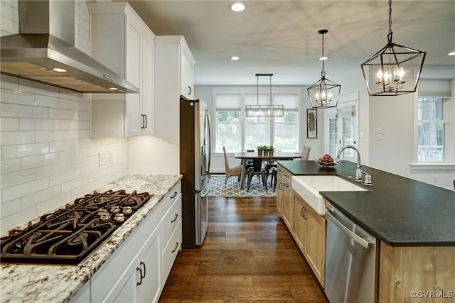 2500 Madison Station Ct, Henrico, VA 23233 - kitchen featuring stainless steel appliances, wall chimney range hood, dark wood-style flooring, recessed lighting, and a chandelier
