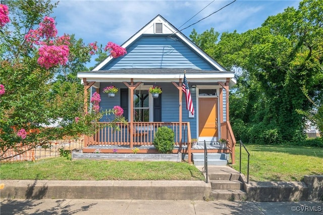 2909 Hull St, Richmond, VA 23224 - view of front of house with covered porch and a front lawn