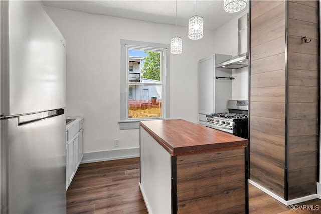 2909 Hull St, Richmond, VA 23224 - kitchen with wood counters, stainless steel appliances, dark wood-style flooring, wall chimney range hood, and a kitchen island