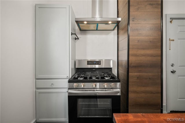 2909 Hull St, Richmond, VA 23224 - kitchen featuring stainless steel range with gas cooktop and wall chimney range hood