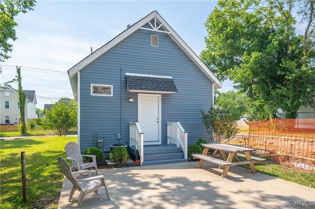 2909 Hull St, Richmond, VA 23224 - rear view of house with a patio area and roof with shingles
