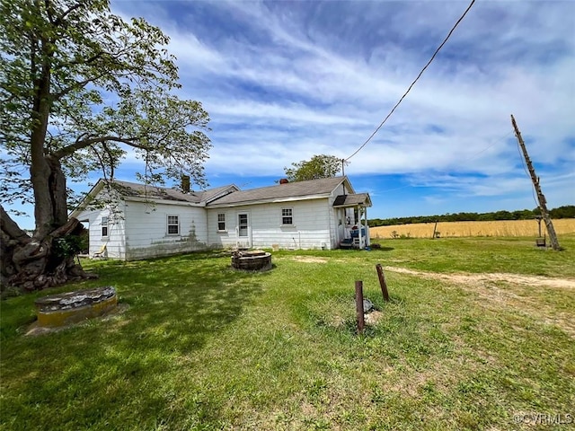 32082 Sparta Rd, Milford, VA 22514 - rear view of property with a fire pit and a yard