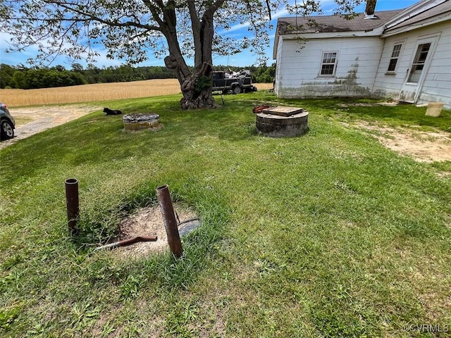 32082 Sparta Rd, Milford, VA 22514 - view of green lawn with an outdoor fire pit