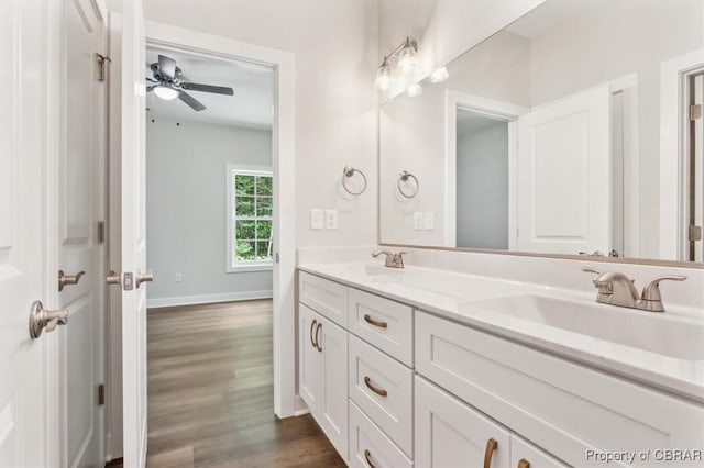 5883 Mill Race Pl, Gloucester, VA 23061 - bathroom featuring double vanity, wood finished floors, and a ceiling fan